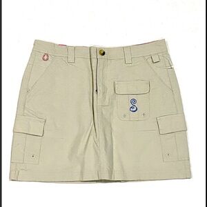 SHE Outdoor skort, featuring multiple cargo pockets and a decorative monogram XL